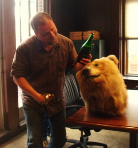 For some reason we have a bear head, dubbed Bad News Bear. The least I can do is offer him some champagne.