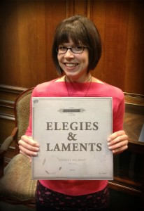 Jennifer Mercer, who designed the Elegies & Laments album (as well as both of Ernest Hilbert's books), poses with the finished product.